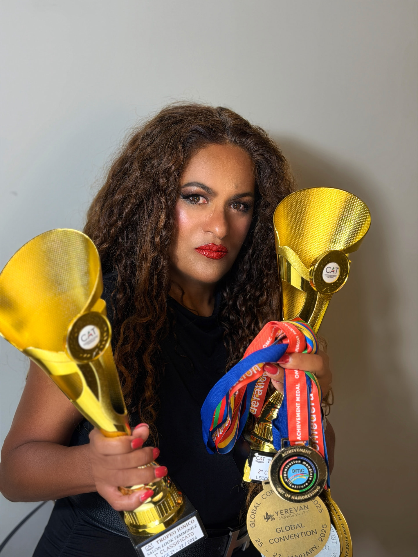 Nanci Cardoso with international competition trophies
